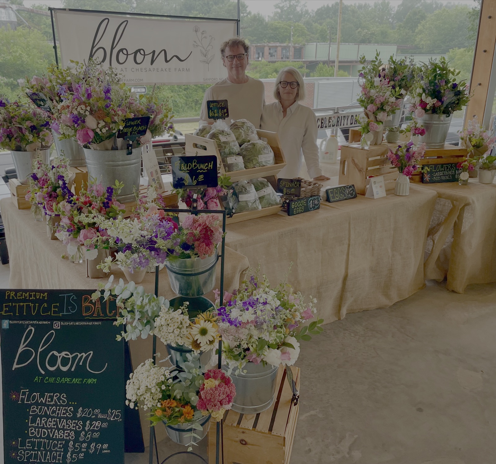 Bloom at Chesapeake Farm’s market stand filled with flowers and fresh produce